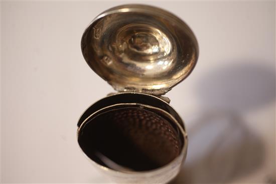 A George III silver vase shaped nutmeg grater, with hinged lid and base, 67mm.